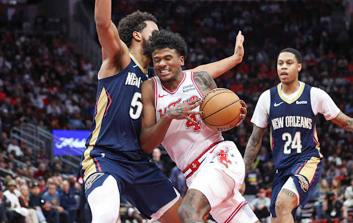 Rockets guard Jalen Green (4) drives with the ball as New Orleans Pelicans forward Jeremiah Robinson-Earl (50) defends during the fourth quarter at Toyota Center.